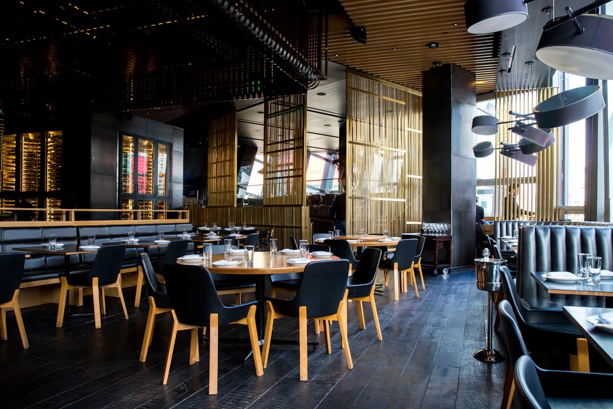 A restaurant with tables ready for a meal together
